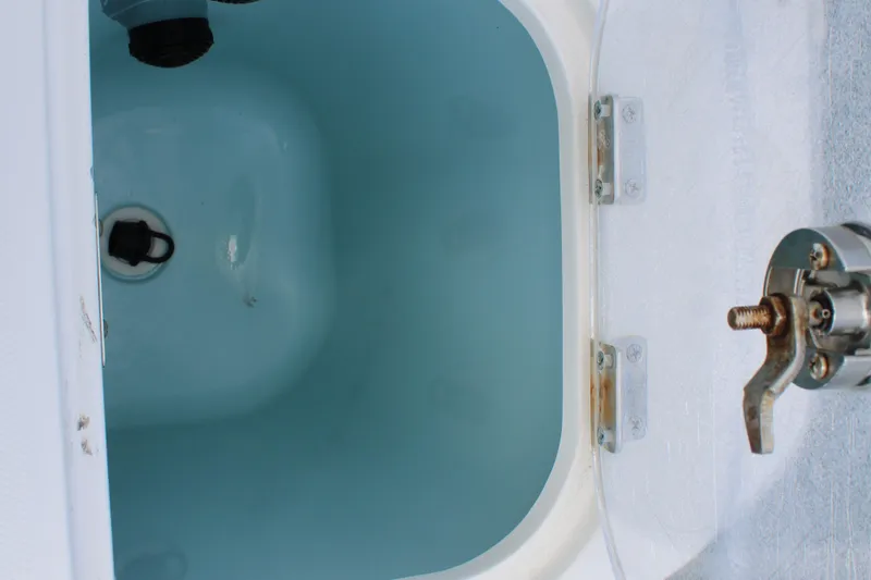 Slide: The Image of Livewell compartment on a 2015 Boston Whaler 320 Outrage boat. - 70