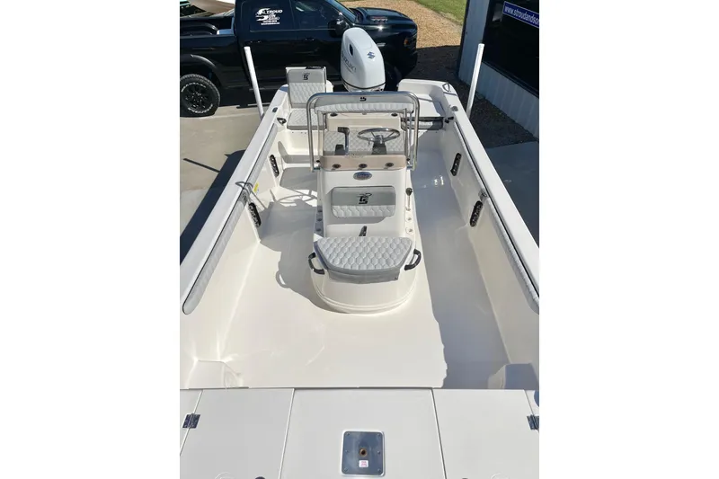 Slide: The Image of 2026 Carolina Skiff 21 LS boat interior with seating and steering console. - 14