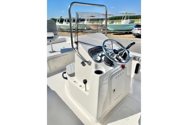 Slide: The Image of 2026 Carolina Skiff 21 LS boat console with steering wheel and controls. - 18