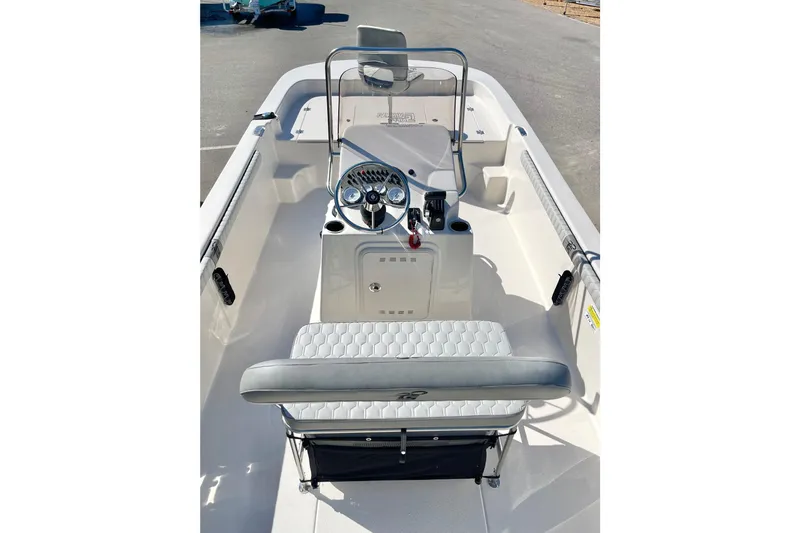 Slide: The Image of 2026 Carolina Skiff 21 LS boat interior with steering console and seating. - 20