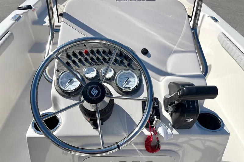 Slide: The Image of Steering console of 2026 Carolina Skiff 21 LS boat with gauges and controls. - 3