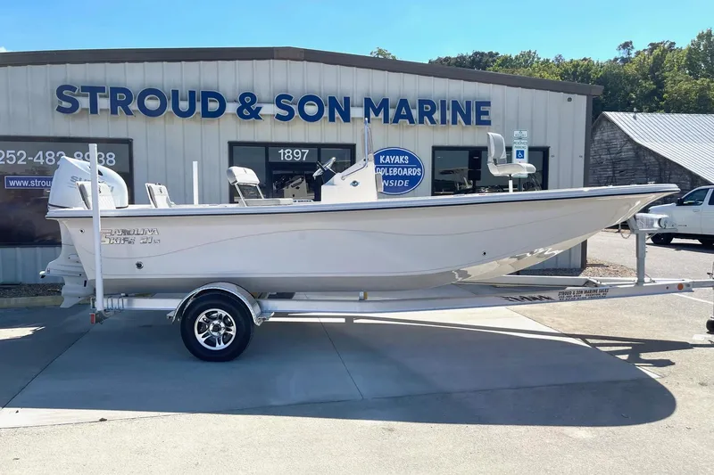 Slide: The Image of 2026 Carolina Skiff 21 LS boat on trailer at Stroud & Son Marine dealership. - 6