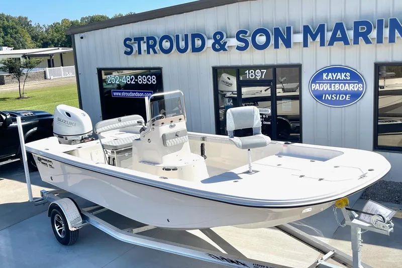 Slide: The Image of 2026 Carolina Skiff 21 LS boat on trailer at Stroud & Son Marine dealership. - 8