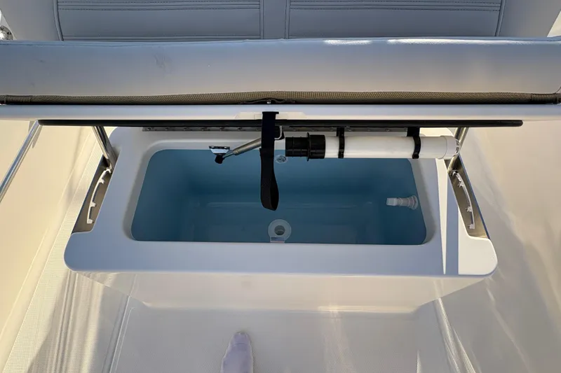 Slide: The Image of 2026 Boston Whaler 170 Montauk boat storage compartment with open lid. - 5