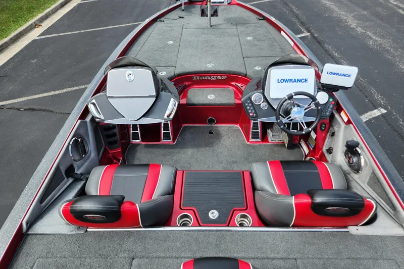 Slide: The Image of 2015 Ranger Z521 Comanche boat interior with red and black seats, dual Lowrance displays. - 5