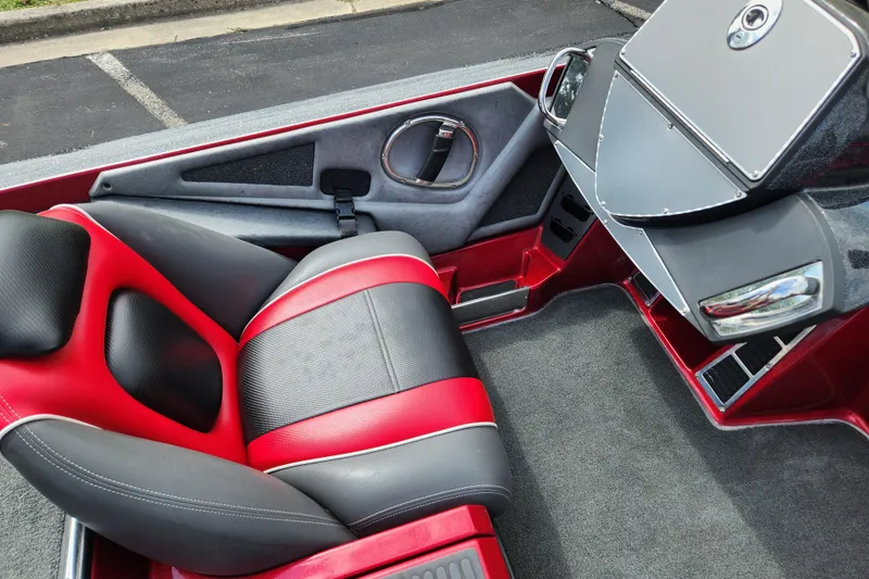 Slide: The Image of 2015 Ranger Z521 Comanche boat interior with red and black seating and dashboard. - 6