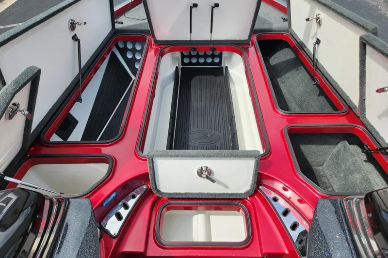 Slide: The Image of 2015 Ranger Z521 Comanche boat storage compartments, open and organized, showcasing ample space. - 7