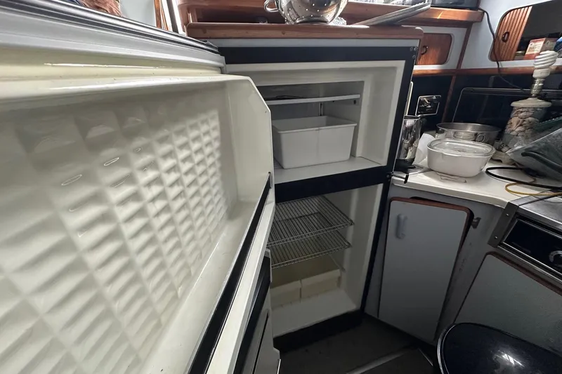 Slide: The Image of Open refrigerator in 1989 Sea Ray 380 Aft Cabin yacht kitchen area. - 16