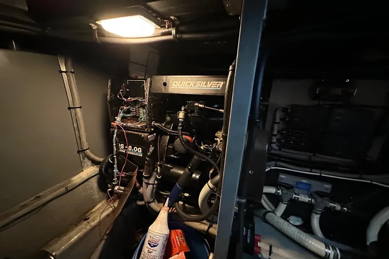 Slide: The Image of Engine room of 1989 Sea Ray 380 Aft Cabin with Quicksilver marine generator. - 23