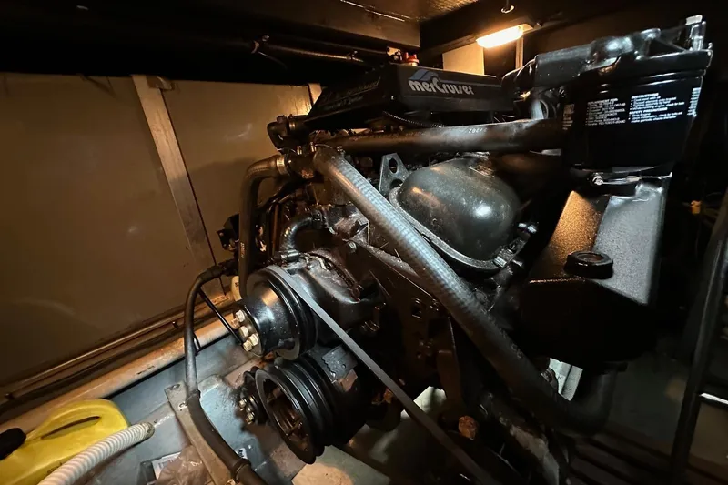 Slide: The Image of Engine room of 1989 Sea Ray 380 Aft Cabin with MerCruiser engine components. - 27
