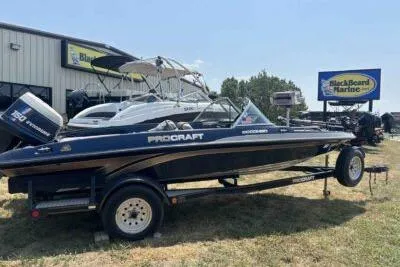 Slide: The Image of 1998 ProCraft 180 Combo boat on trailer at BlackBeard Marine dealership. - 5
