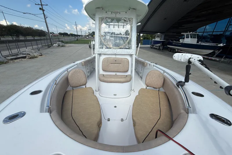 Slide: The Image of 2019 Sportsman 232 OE boat interior with cushioned seating and modern design. - 10