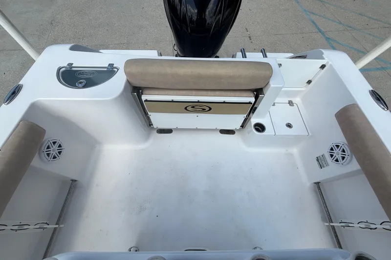 Slide: The Image of 2019 Sportsman 232 OE boat interior with seating and storage compartments. - 12