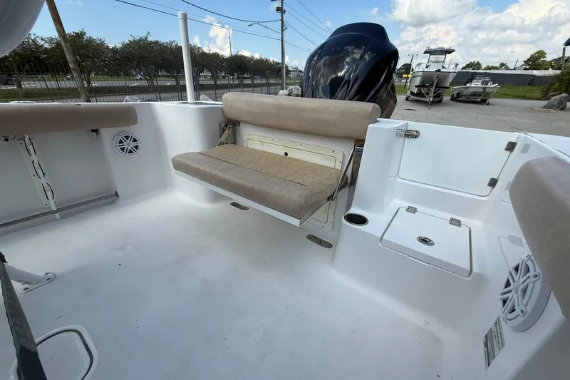Slide: The Image of 2019 Sportsman 232 OE boat interior with seating and storage compartments. - 13