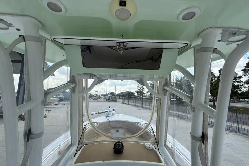 Slide: The Image of 2019 Sportsman 232 OE boat interior with console and overhead electronics. - 16