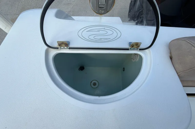 Slide: The Image of Open storage compartment on a 2019 Sportsman 232 OE boat. - 18