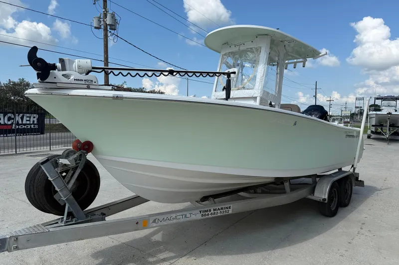 Slide: The Image of 2019 Sportsman 232 OE boat on trailer, featuring Minn Kota trolling motor. - 4