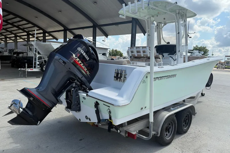 Slide: The Image of 2019 Sportsman 232 OE boat with Yamaha outboard motor on a trailer. - 7