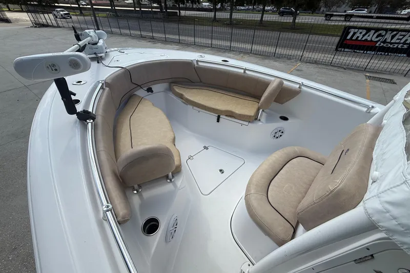 Slide: The Image of 2019 Sportsman 232 OE boat interior with beige seating and modern design. - 9
