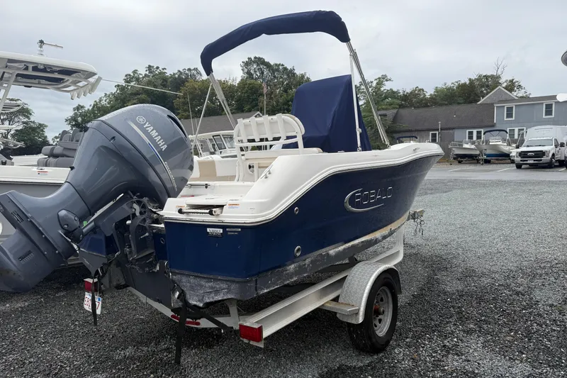 Slide: The Image of 2019 Robalo R180 Center Console boat with Yamaha engine on trailer. - 1