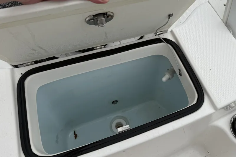 Slide: The Image of Open storage compartment on 2019 Robalo R180 Center Console boat. - 11