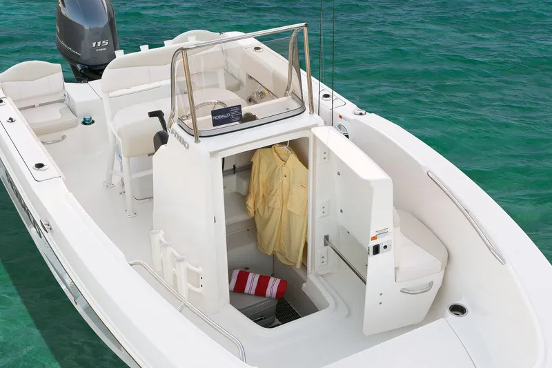 Slide: The Image of Manufacturer Provided Image: 2019 Robalo R180 Center Console boat interior with storage and seating. - 13