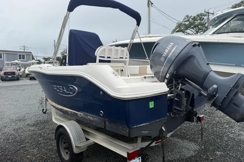 Slide: The Image of 2019 Robalo R180 Center Console boat with Yamaha outboard motor on trailer. - 3
