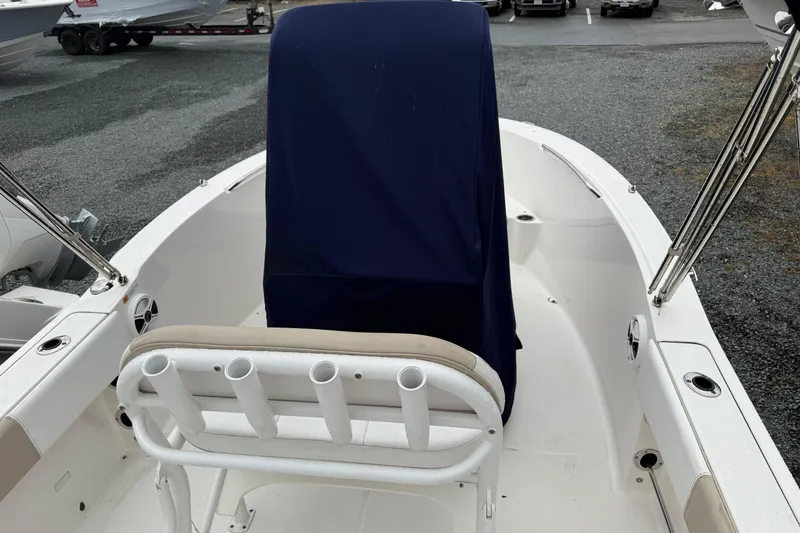 Slide: The Image of 2019 Robalo R180 Center Console boat interior with covered console and rod holders. - 5
