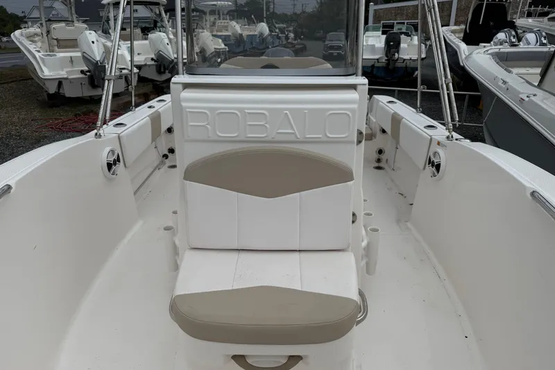 Slide: The Image of 2019 Robalo R180 Center Console boat interior with seating and console view. - 6