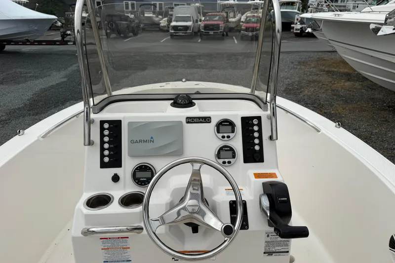 Slide: The Image of 2019 Robalo R180 Center Console boat dashboard with Garmin navigation system. - 7
