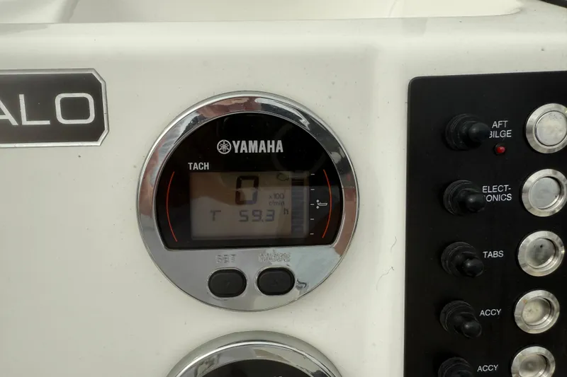 Slide: The Image of 2019 Robalo R180 Center Console dashboard with Yamaha tachometer and control switches. - 8