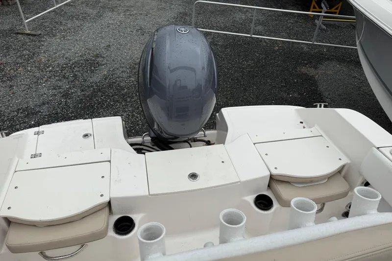Slide: The Image of 2019 Robalo R180 Center Console boat with outboard motor and rod holders. - 9