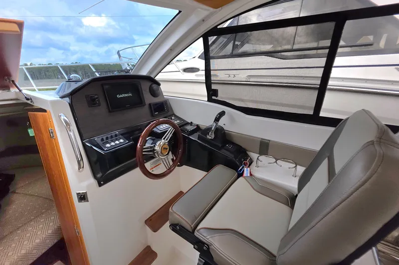 Slide: The Image of 2020 Cutwater C-24 helm with Garmin navigation, leather seating, and modern controls. - 17
