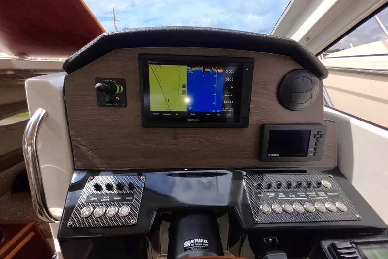 Slide: The Image of Helm of 2020 Cutwater C-24 boat with Garmin navigation display and control panel. - 20