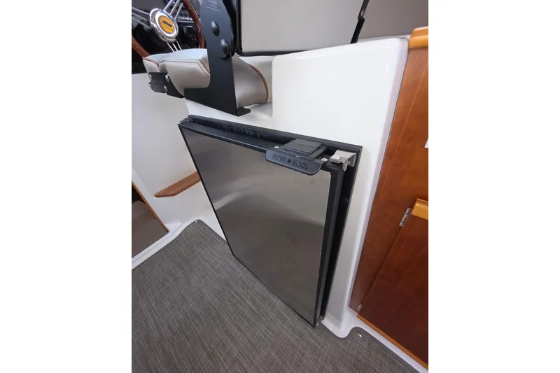 Slide: The Image of 2020 Cutwater C-24 interior with compact stainless steel fridge. - 24
