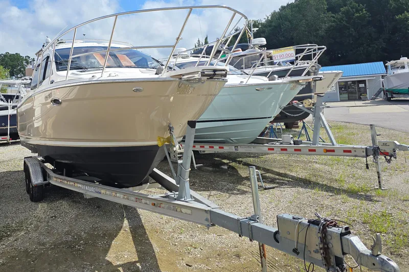 Slide: The Image of 2020 Cutwater C-24 boat on trailer, displayed outdoors at a dealership. - 5