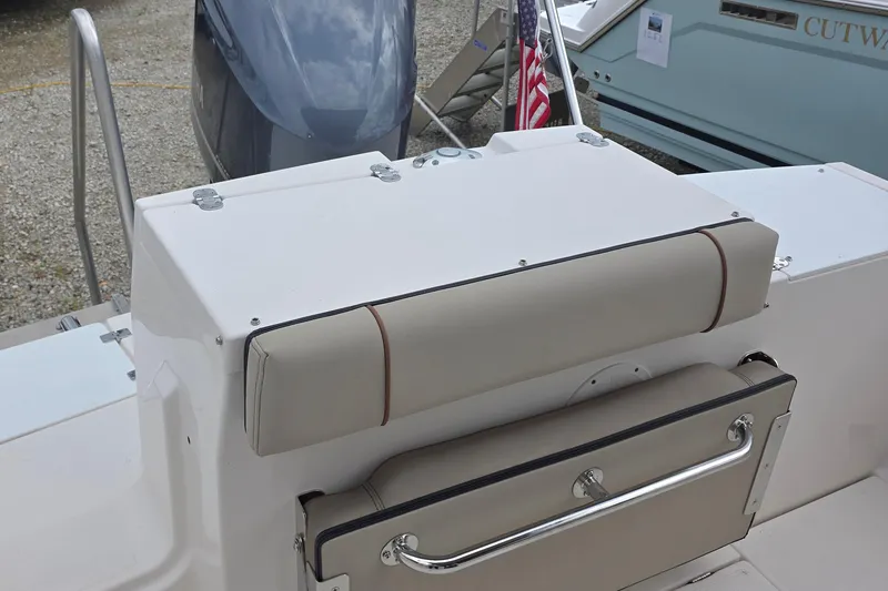 Slide: The Image of 2020 Cutwater C-24 boat seating area with cushioned backrest and metal railing. - 8