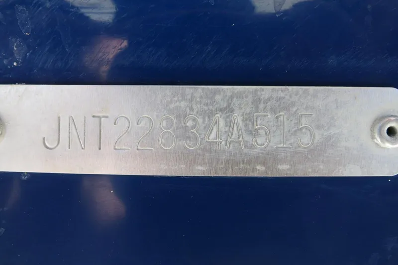 Slide: The Image of 2015 NauticStar 203SC Sport Deck hull identification number plate. - 14