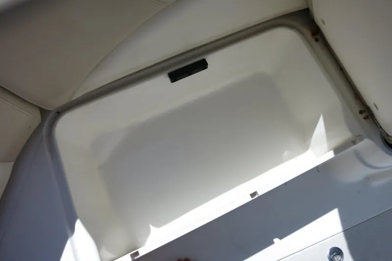 Slide: The Image of Storage compartment in 2015 NauticStar 203SC Sport Deck boat. - 22