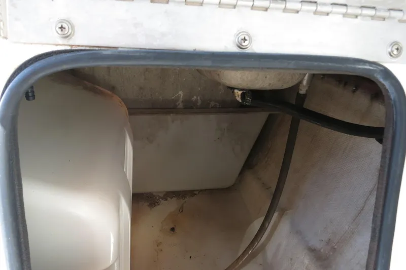 Slide: The Image of Storage compartment of 2015 NauticStar 203SC Sport Deck boat, showing interior details. - 27
