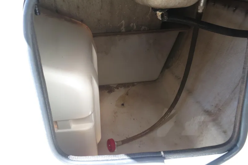 Slide: The Image of Storage compartment of a 2015 NauticStar 203SC Sport Deck boat, showing interior details. - 29
