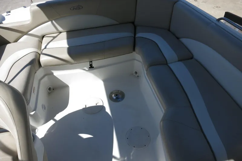 Slide: The Image of 2015 NauticStar 203SC Sport Deck boat interior with gray seating and spacious layout. - 30