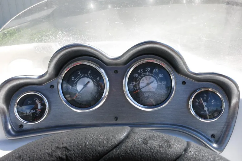 Slide: The Image of Dashboard of a 2015 NauticStar 203SC Sport Deck boat with gauges and steering wheel. - 36