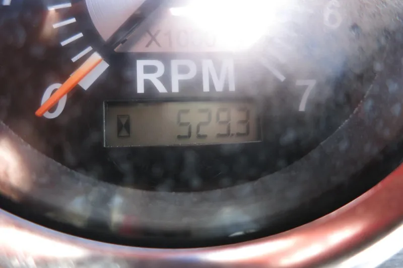 Slide: The Image of Close-up of RPM gauge showing 529.3 hours on a 2015 NauticStar 203SC Sport Deck. - 37