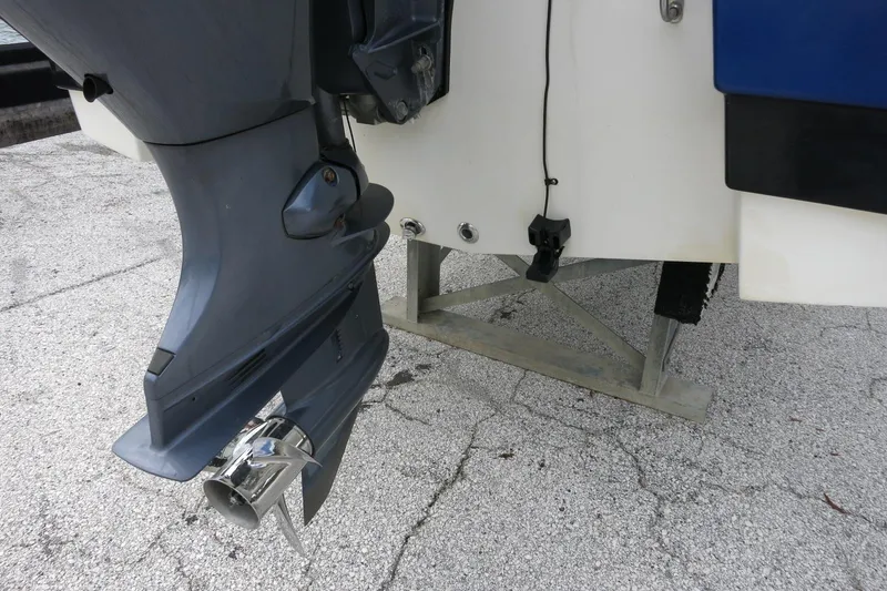 Slide: The Image of 2015 NauticStar 203SC Sport Deck boat motor and propeller on a stand. - 47