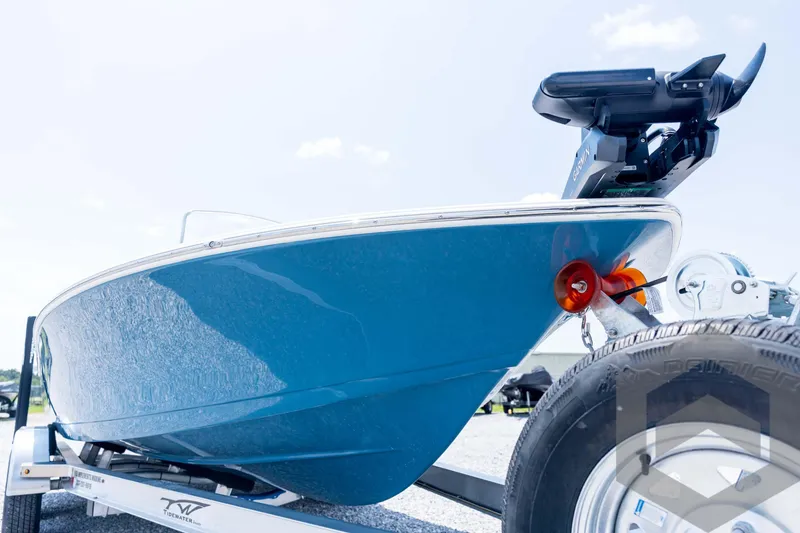 Slide: The Image of 2026 Tidewater 2110 Bay Max boat on trailer, close-up view. - 12