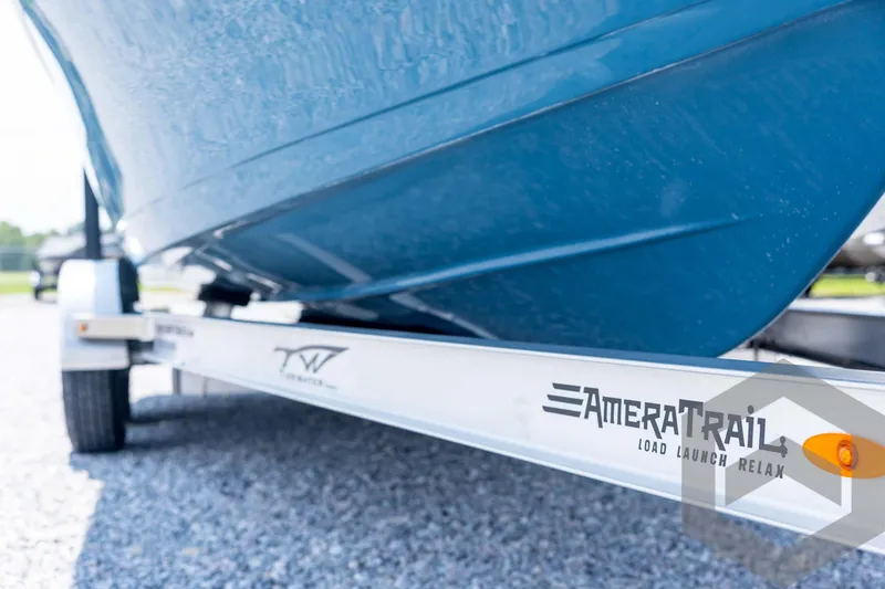 Slide: The Image of 2026 Tidewater 2110 Bay Max boat on AmeraTrail trailer, close-up view. - 13