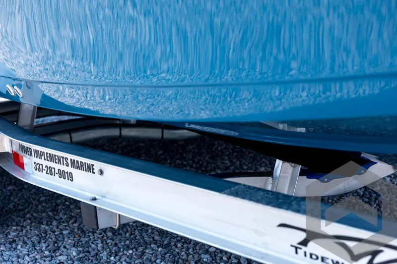 Slide: The Image of 2026 Tidewater 2110 Bay Max boat on trailer, close-up view. - 14