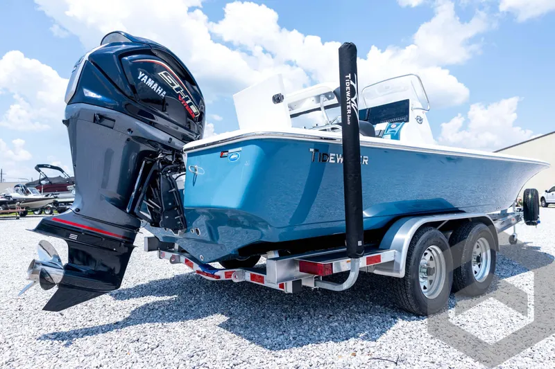 Slide: The Image of 2026 Tidewater 2110 Bay Max boat on trailer with Yamaha engine, parked on gravel. - 16