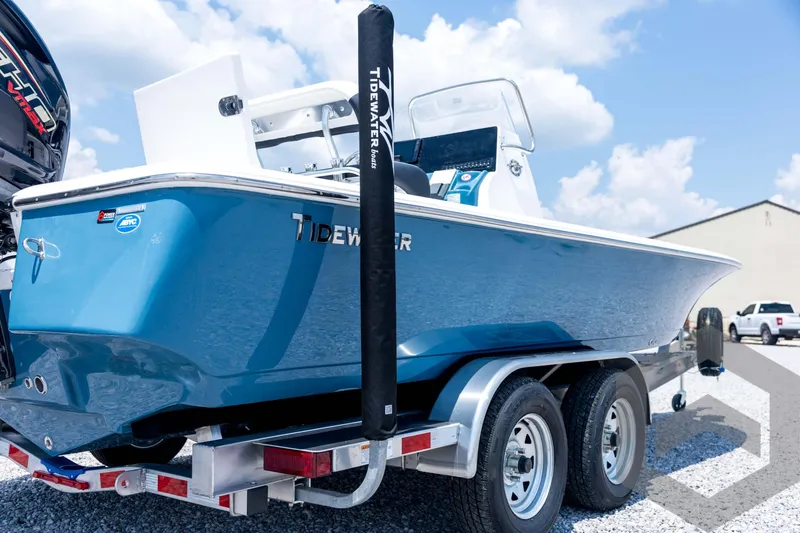 Slide: The Image of 2026 Tidewater 2110 Bay Max boat on trailer, blue hull, sunny day. - 17